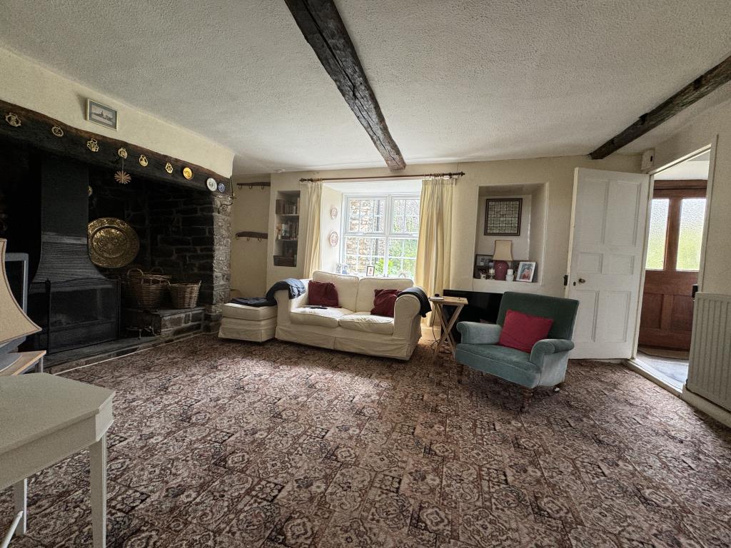 Lot: 49 - FIVE-BEDROOM FARMHOUSE FORMER BED & BREAKFAST PREMISES - Sitting room with inglenook fire place